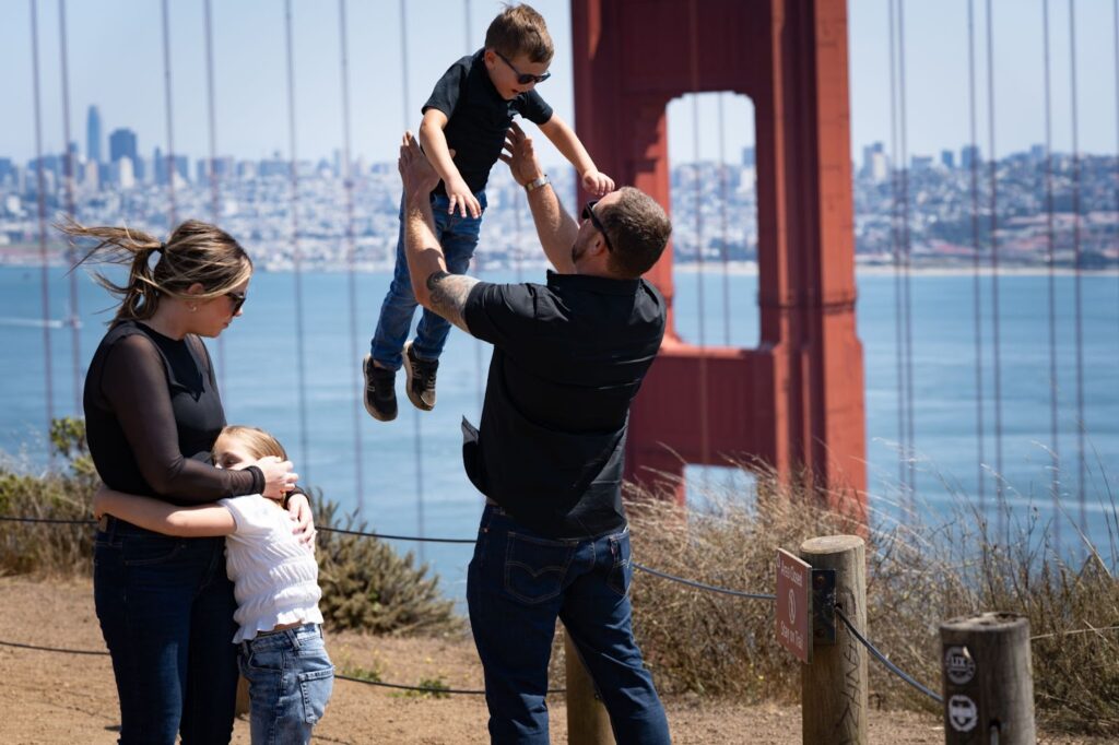 Family portrait with the Golden Gate Bridge in the background during a San Francisco photo session