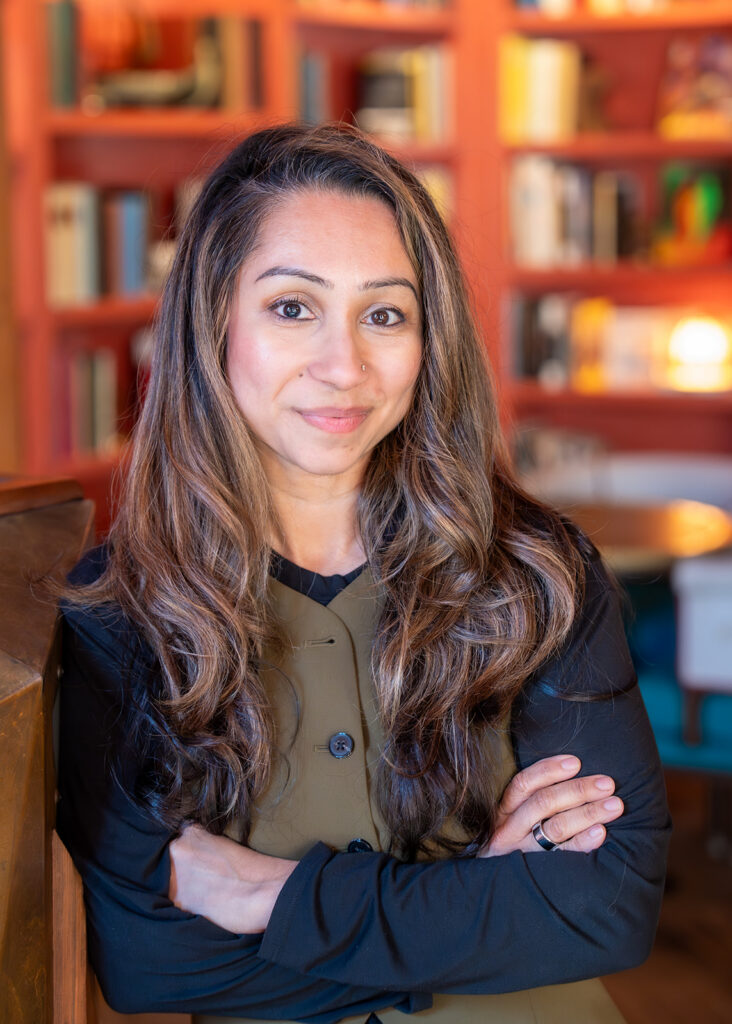 Indegene SF Roundtable Headshot of a woman standing and smiling